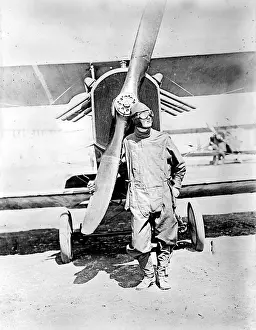 Lcgrn: Pilot standing in front of U.S. Army airplane ?