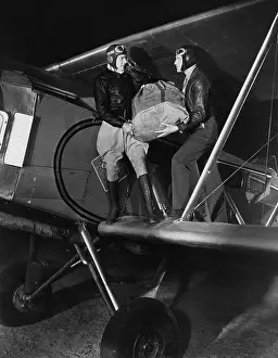 Cooperate: Two pilots on a mail plane