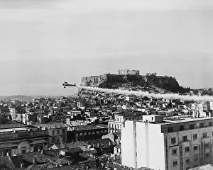 Insecticides: A plane dusts the ancient city of Athens with