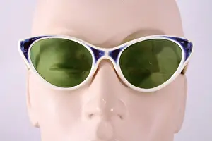 Lenses: Plastic frame in white blue, green glass lenses