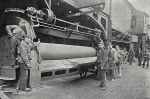 Cogs: Plate rolling machine and workers at a Sunderland shipyard