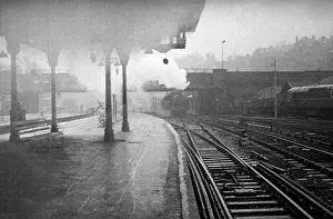 Redhill: Empty platform with steam train approaching