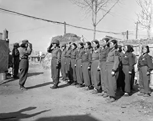 Koreans: A platoon of the Korean Women's Army prepares for