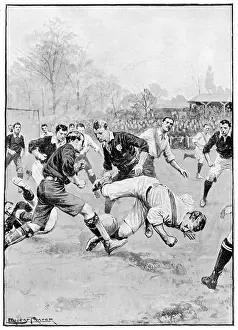 Tackle: A player falls during a football match