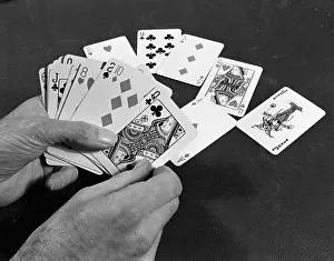 Dealt: PLAYING ONE'S HAND