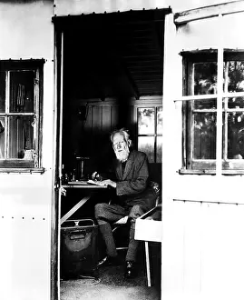 Playwright George Bernard Shaw making notes ?