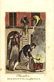 Plumbing: Plumber heating lead in a fire to fix lead