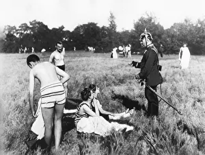 Notebook: A police officer warns people in bathing suits