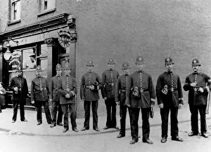Police officers outside a barber's shop