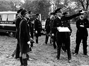 Searching: Police officers preparing to conduct a search, London