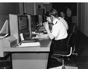 Policewoman: Police officers at work in communications room