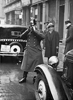 Evidence: Police official with a camera, 1932