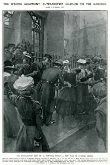Enfranchisement: Police removing suffragettes chained to railings 1908