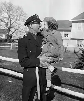 Nightstick: Policeman Carrying Young Girl