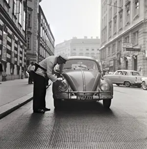 Safty: Policeman cleaning headlights