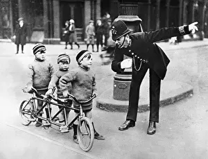 Policeman giving directions to children