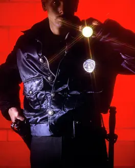 Del003: Policeman Hand on Gun with Flashlight Pointed