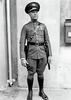 Jodhpurs: a Policeman in Full Length Uniform Looking at Camera Ha