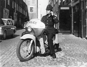 Respond: POLICEMAN ON MOTORBIKE