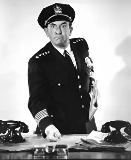 Pounding: Policeman pounding his fist on desk