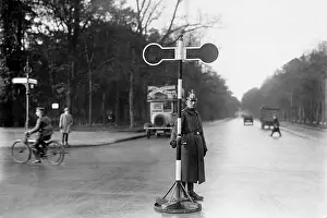 Signaling: Policeman at a street crossing, 1925