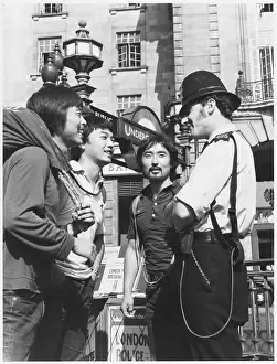 POLICEMAN AND TOURISTS