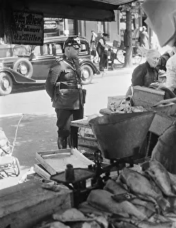 Patrols: Policeman at a weekly market in Berlin, 1938