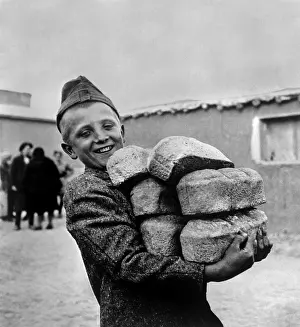Loafs: Polish youngster with bread made from flour supplied