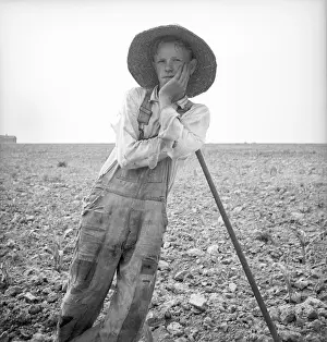Lcgr1305: Poor white farm boy leaning on his hoe in North