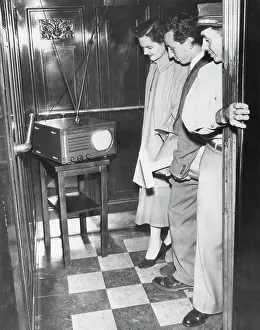 Dodgers: Portable television in a New York City elevator