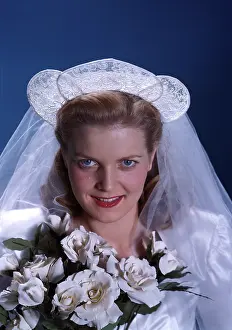 Portait: Portait of bride holding white roses