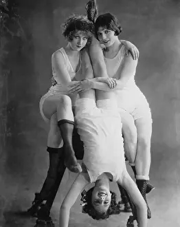 Handstand: Portrait of three acrobatic women