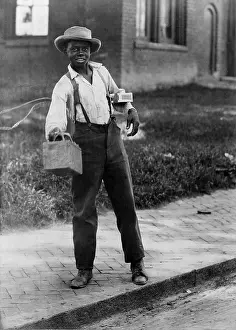 Bootblack: Portrait of an African American man with ?