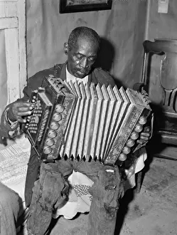 Borrower: Portrait of an African American man playing ?