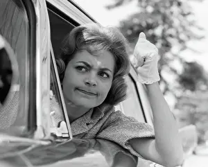 Gloved: Portrait of angry woman driver gesturing with