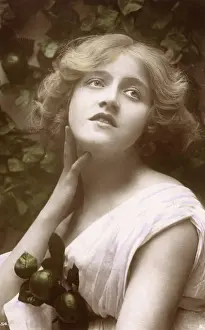 Tilted: Portrait of a beauty with green apples