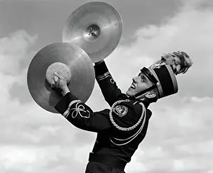 Marcher: Portrait of boy in band uniform playing instrument