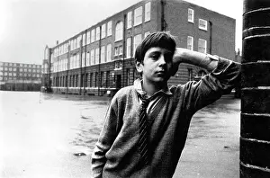 Askew: Portrait of a boy in school playground