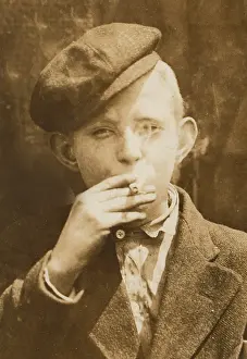 Skeeters: Portrait of a boy smoking, original caption: ?