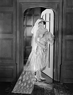 Newlywed: Portrait of bride in doorway