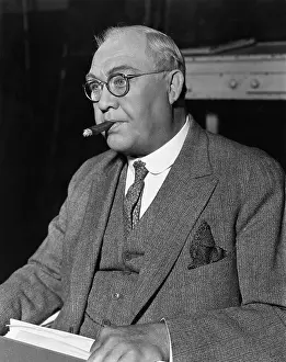 Habitual: Portrait of businessman smoking cigar