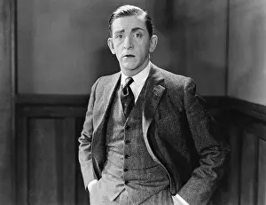 Waist Up: Portrait of a businessman standing with his hands