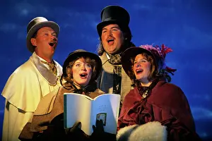 Caroler: Portrait Of Four Christmas Carolers
