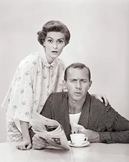 Bathrobes: Portrait Couple in Bathrobes Looking at Camera with