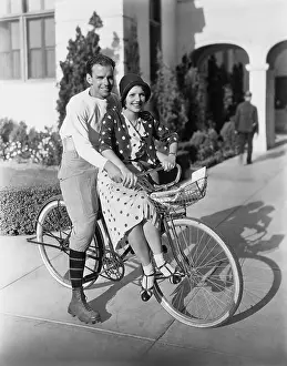 Bicyclist: Portrait of couple on bicycle together