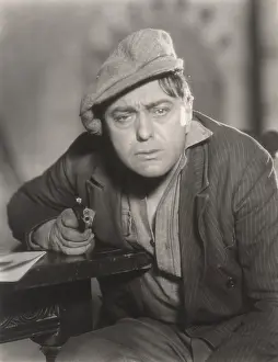 Despondent: Portrait of despondent man pointing gun