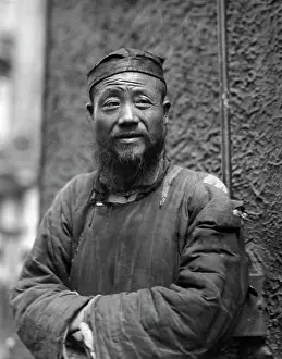 Headware: Portrait of an elderly Chinese priest