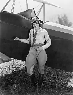 Capability: Portrait of female aviator with plane