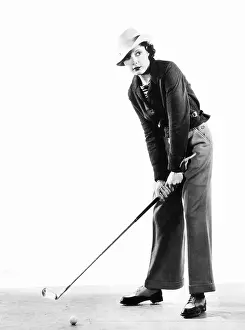 Cuffed: Portrait of a female golfer