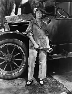 Frown: Portrait of female mechanic